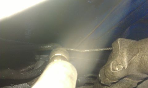 1991 Ford Festiva - This image shows a close-up of an automotive part, possibly related to the A/C or power steering system.
