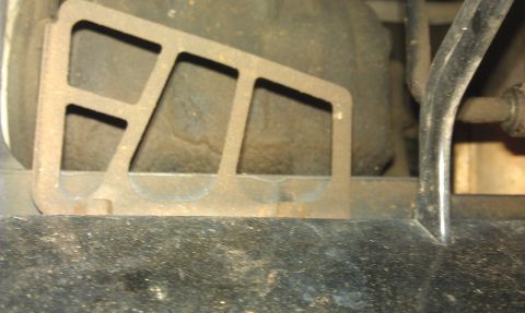 1991 Ford Festiva - This photo shows a metal bracket and other car parts, not a 1991 Ford Festiva.