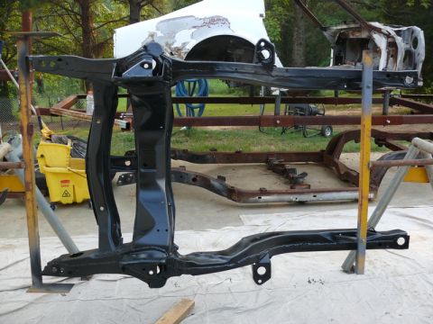 1968 Chevrolet Camaro - A vehicle frame, likely undergoing restoration, is the main focus, with another frame visible in the background.