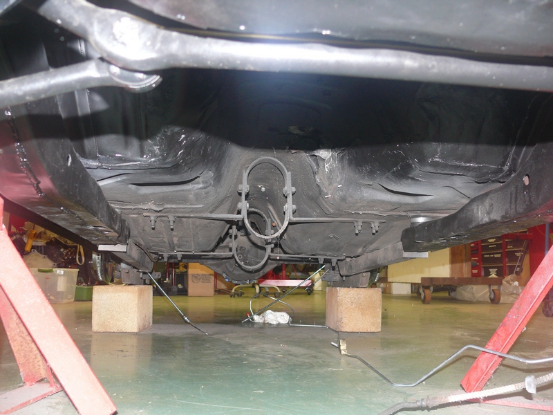 Undercarriage of a 1968 Chevrolet Camaro, viewed from the rear, showing the exhaust system and differential
