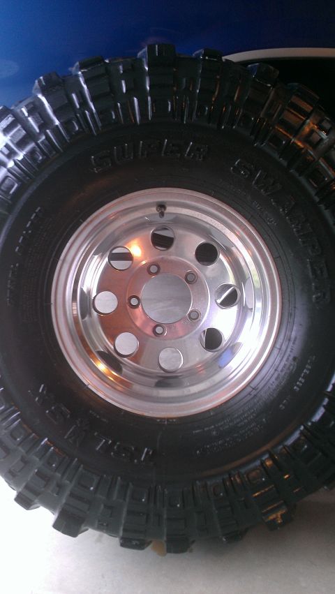 1978 Ford Bronco - This photo shows a Super Swamper off-road tire mounted on a polished aluminum wheel.