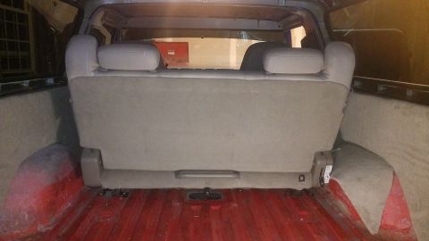 1978 Ford Bronco - Interior rear seat and cargo area of a vehicle, with a visible Supermotors.net watermark.