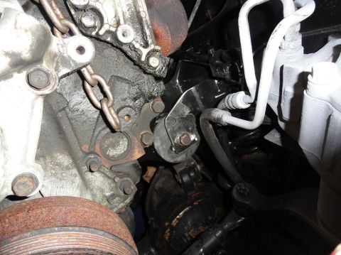 1989 Jeep Cherokee - Close-up view of an engine mount and associated hoses, showing mechanical components.