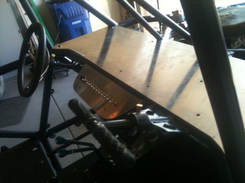 1966 Ford Bronco - Interior view of a custom-built buggy, showing the steering column and roll cage structure.