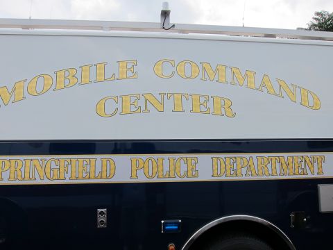 1991 Ford LTD Crown Victoria - close-up of a vehicle body panel with gold lettering reading Mobile Command Center, Springfield Police Department.