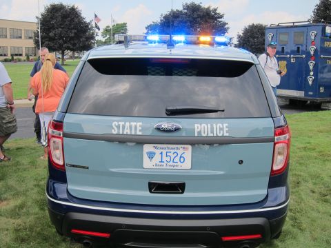 1991 Ford LTD Crown Victoria - rear of a two-tone blue Ford Explorer State Police SUV, hatch lettered STATE POLICE with a Massachusetts 1526 trooper plate.