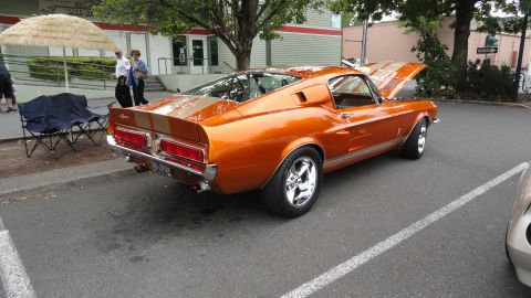 1964 Ford Fairlane - This 1967 Shelby GT500 is a striking orange with racing stripes and chrome wheels.