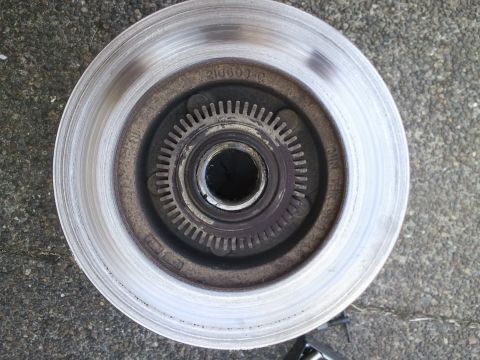 1994 Ford Bronco - Close-up of a brake rotor, showing part number 210603-C stamped on the hub assembly.