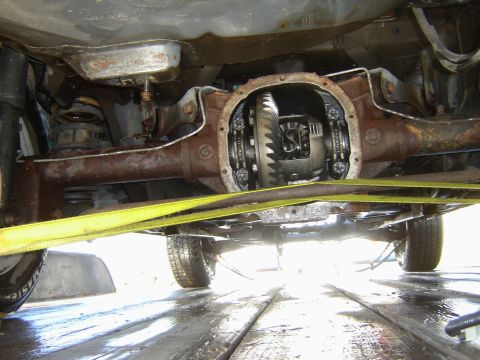 1987 Ford Mustang - Close-up of a vehicle's open rear differential, showing internal gears and components.