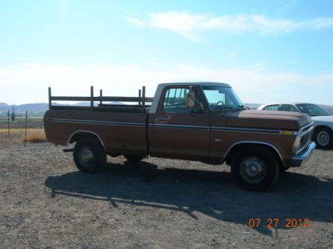 1979 Ford F-150 - Side view of a 1979 Ford F-150 pickup truck with a wooden rack in the bed.