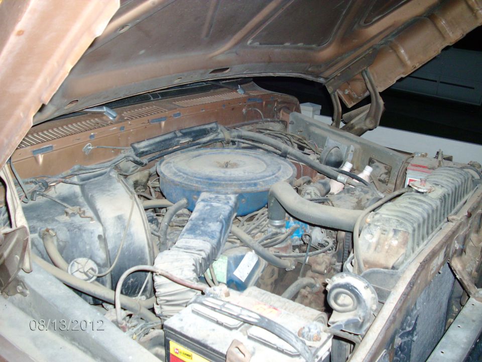 Engine bay with air cleaner, radiator, and battery visible. Date stamp reads 08/13/2012