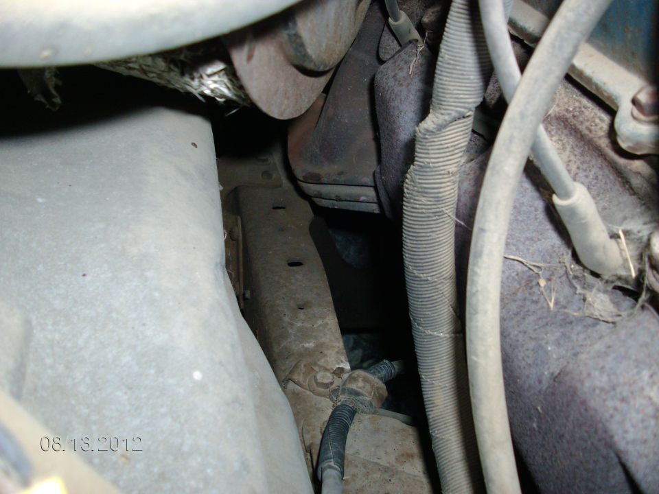 Close-up of engine bay with hoses and metal parts visible. Date stamp reads 08.13.2012