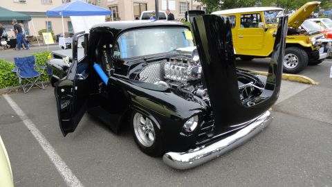 1964 Ford Fairlane - Custom hot rod pickup truck with its hood open, revealing a supercharged engine, parked outdoors.