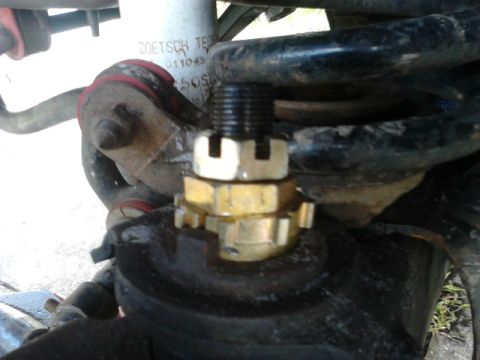 1996 Ford Bronco - Jack the wheel up and take the tire off. secure it properly. Remove the cotter pin that prevents the nut from vibrating loose. Take the nut…