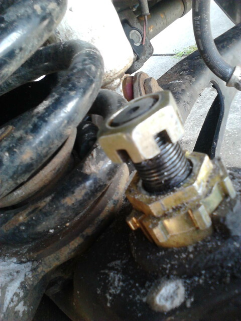 1996 Ford Bronco - Put the nut back on upside down and make it flush with the top of the balljoint stud as shown. this protects the threadsfrom being damaged.…