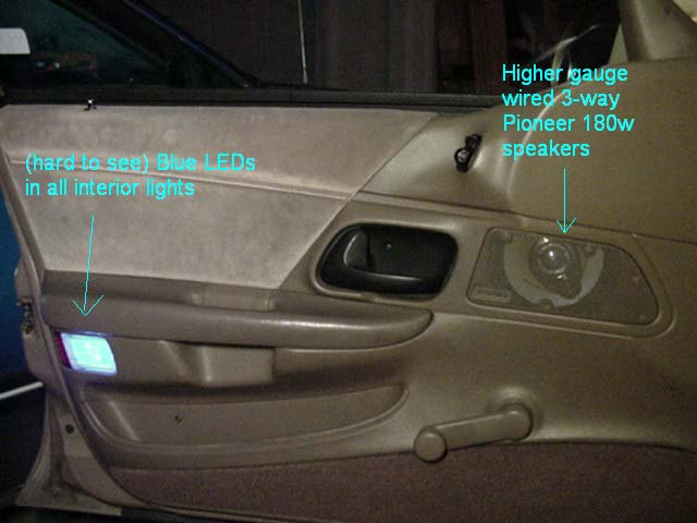 Tan car door panel with annotations pointing to blue LED courtesy light and Pioneer 3-way speaker