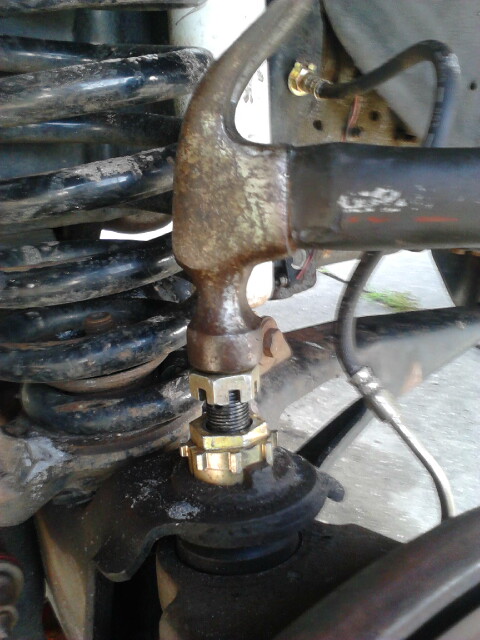1996 Ford Bronco - With a hammer, hit the ball joint straight down flush with the nut. When you hit it down you will see the stud go down and in my case will…