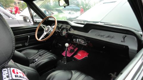1964 Ford Fairlane - The dashboard features a 'Carroll Shelby' script and a Cobra emblem, indicating a Shelby GT500 model.