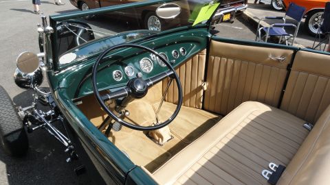 1964 Ford Fairlane - The interior of a custom hot rod shows off its tan upholstery and dashboard gauges.
