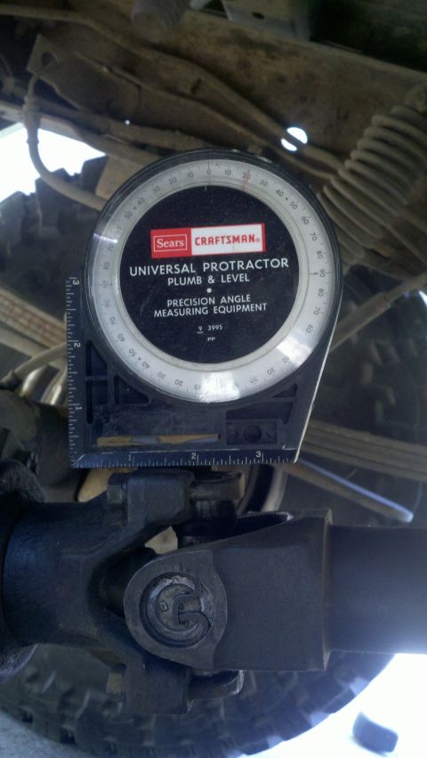 1978 Ford Bronco - A Sears Craftsman universal protractor is used to measure the angle of a vehicle's driveshaft.