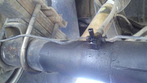 1978 Ford Bronco - Detail of rear axle and suspension components, with a visible Supermotors.net logo in the corner.