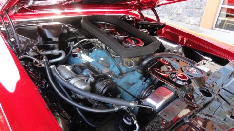 1964 Ford Fairlane - The engine bay shows a Pontiac V8 with a triple carburetor setup and chrome accents.