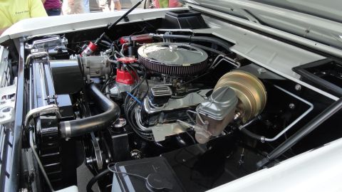 1964 Ford Fairlane - Detailed view of a clean engine bay, showing various components and polished parts.