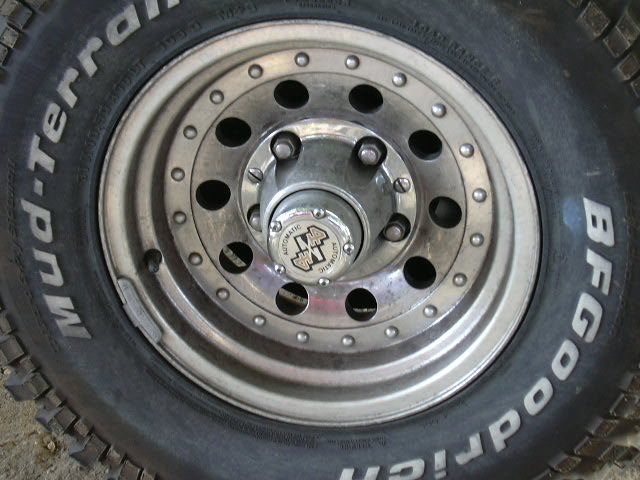 Polished alloy wheel with BFGoodrich Mud-Terrain tire and Warn automatic locking hub cap