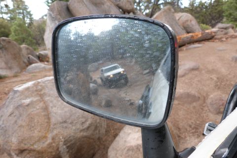 1985 Toyota 4Runner - Off-road vehicle seen in the side mirror during a trail drive.