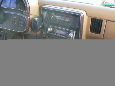 1991 Ford Bronco - The dashboard features a CB radio and two aftermarket stereo units.
