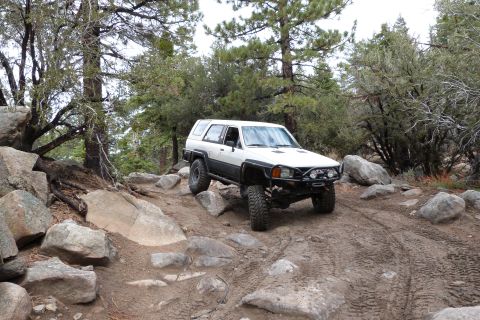 1985 Toyota 4Runner - Off-roading in a 1985 Toyota 4Runner on a challenging mountain trail.
