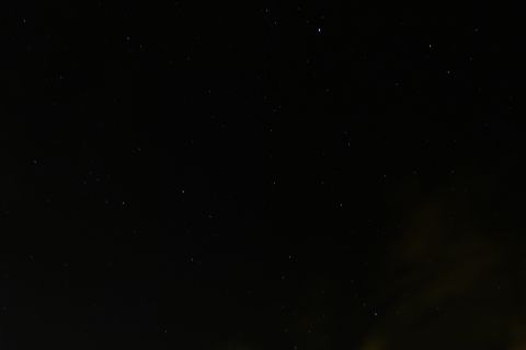 1985 Toyota 4Runner - A clear night sky is visible, dotted with numerous stars and a subtle glow on the horizon.