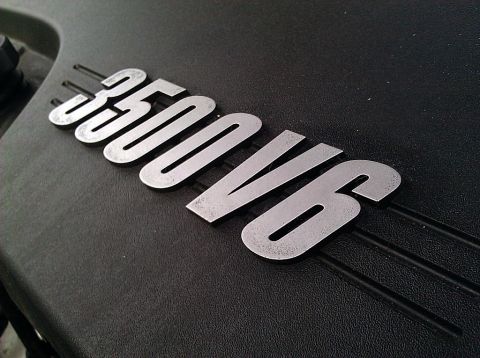 2008 Chevrolet Impala - A close-up view of the '350 V6' emblem on a vehicle's engine cover.