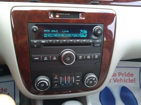 2008 Chevrolet Impala - The dashboard of a car displays the radio and climate control system.
