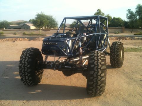 1966 Ford Bronco - This custom off-road buggy features a prominent roll cage and oversized tires, suggesting it is built for extreme terrain.