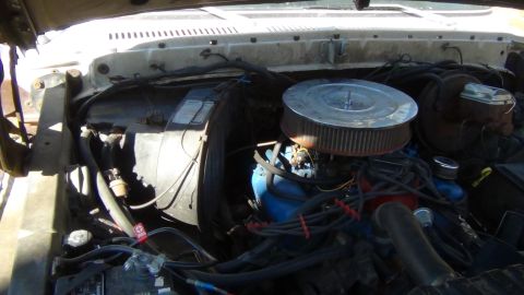 1979 Ford Bronco - The engine bay of a vehicle, showing various components and wiring.