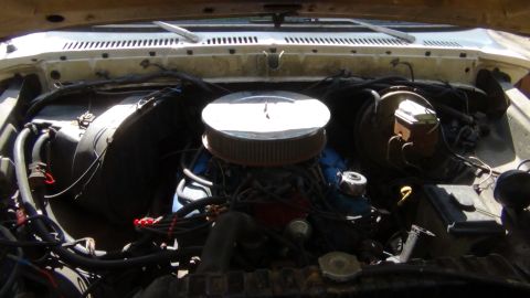 1979 Ford Bronco - View of the engine bay, showing the air filter assembly and brake fluid reservoir.