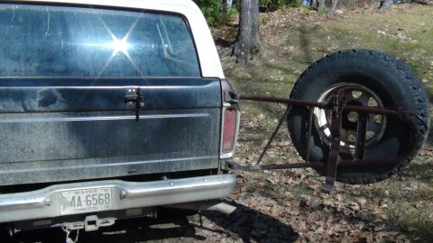 1979 Ford Bronco - Rear view of a Ford Bronco with a swing-away spare tire carrier mounted. Maine plate visible.
