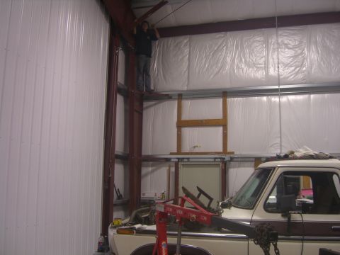 1979 Ford Bronco - This 1979 Ford Bronco is parked inside a garage, possibly undergoing maintenance.