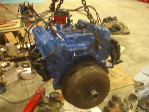 1979 Ford Bronco - Engine assembly, likely a V8, being worked on or installed. No specific year or vehicle identified.