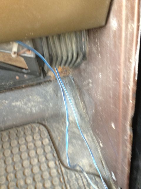 1979 Ford Bronco - Loose wiring is visible on the floor of the vehicle's cabin.