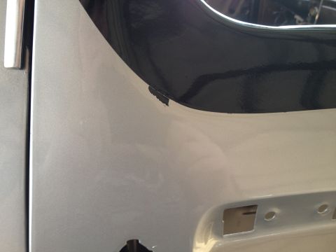 1979 Ford Bronco - Detail of a vehicle's body panel, showing a section of trim and a watermark.