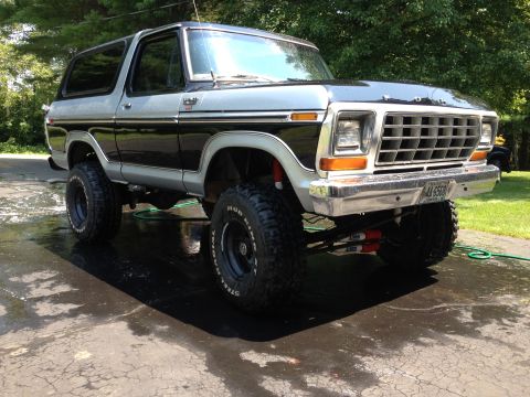 1979 Ford Bronco - This lifted 1979 Ford Bronco features a distinctive black and silver two-tone paint scheme and aggressive off-road tires.