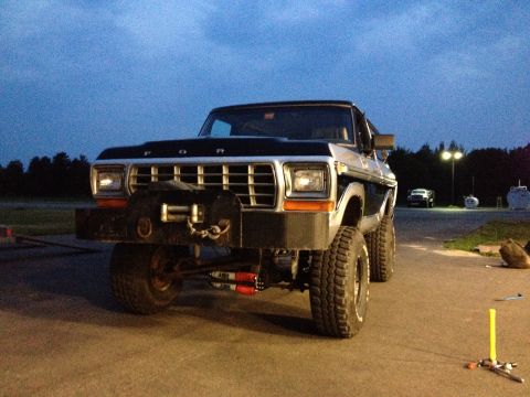 1979 Ford Bronco - Front view of a lifted 1979 Ford Bronco with a winch and aftermarket bumper.