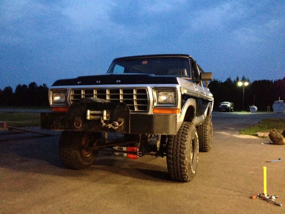 1979 Ford Bronco with aftermarket bumper and winch, lifted suspension. Another vehicle visible in background