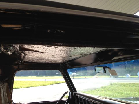 1979 Ford Bronco - View from inside a 1979 Ford Bronco, looking out at an airfield with a small plane.