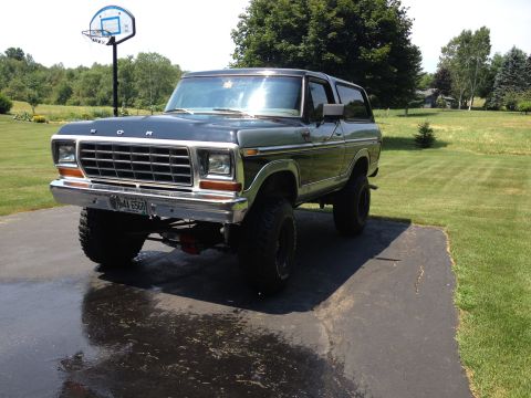 1979 Ford Bronco - This lifted Ford Bronco, likely a 1978 model, is shown from a three-quarter front angle on a paved surface.