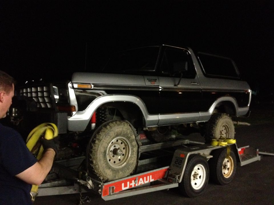 Black and silver 1979 Ford Bronco on trailer