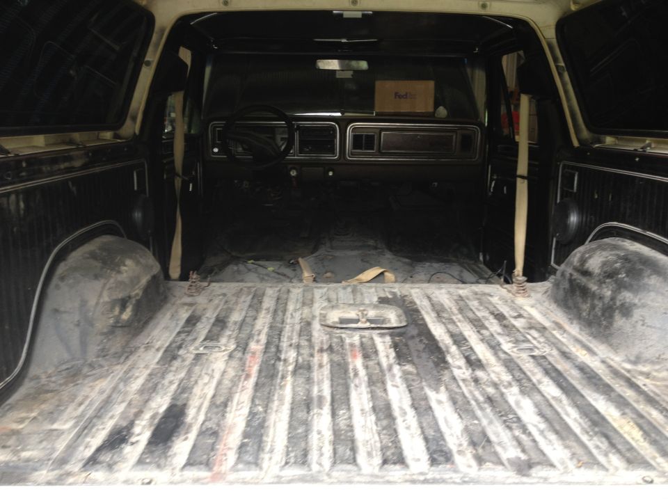 Interior view of a 1978 Ford Bronco, showing the cargo area and dashboard