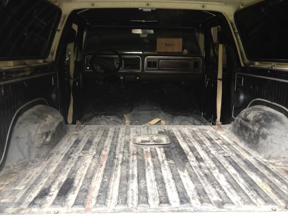 Interior view of a 1979 Ford Bronco, showing the cargo area and dashboard